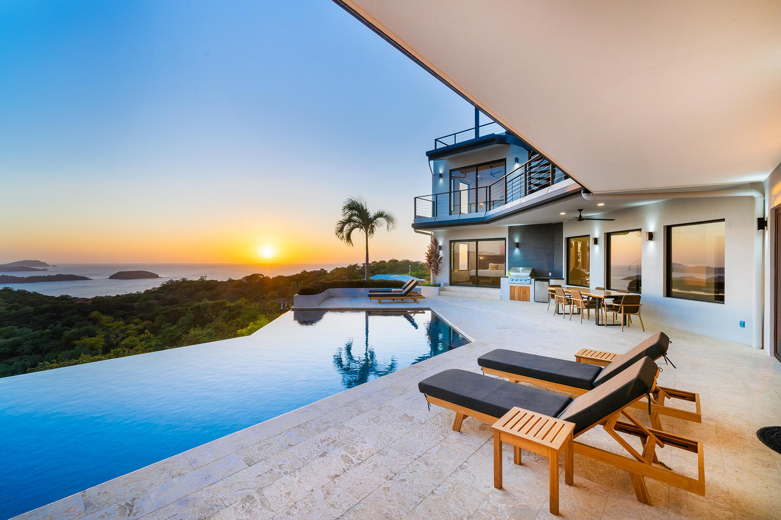 Infinity pool at sunset meeting the ocean horizon