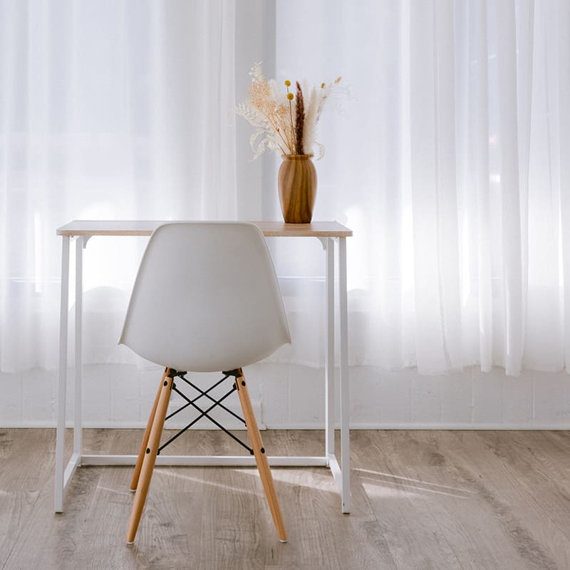 Chair and table with a flowerpot