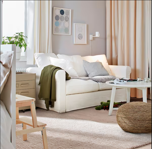 Minimalist-living-room-with-sofa-wooden-table-and-wooden-chairs Minimalist living room with a sofa, wooden chairs and wooden table