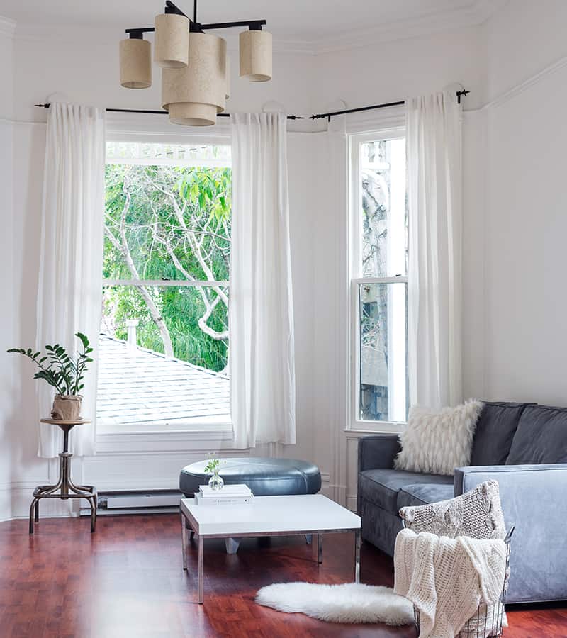 living_room_with_windows Modern and furnished living room with windows and curtains