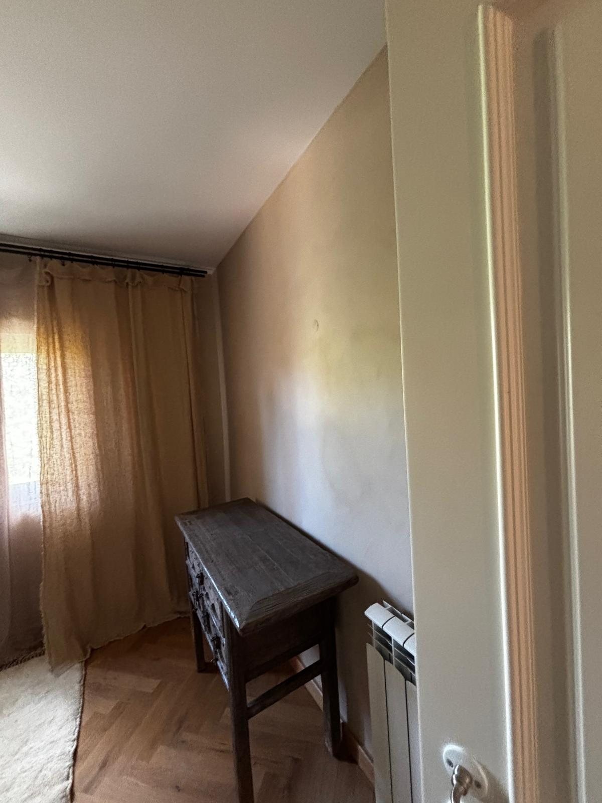 Bedroom at Quinta Girassol before renovation, original wall